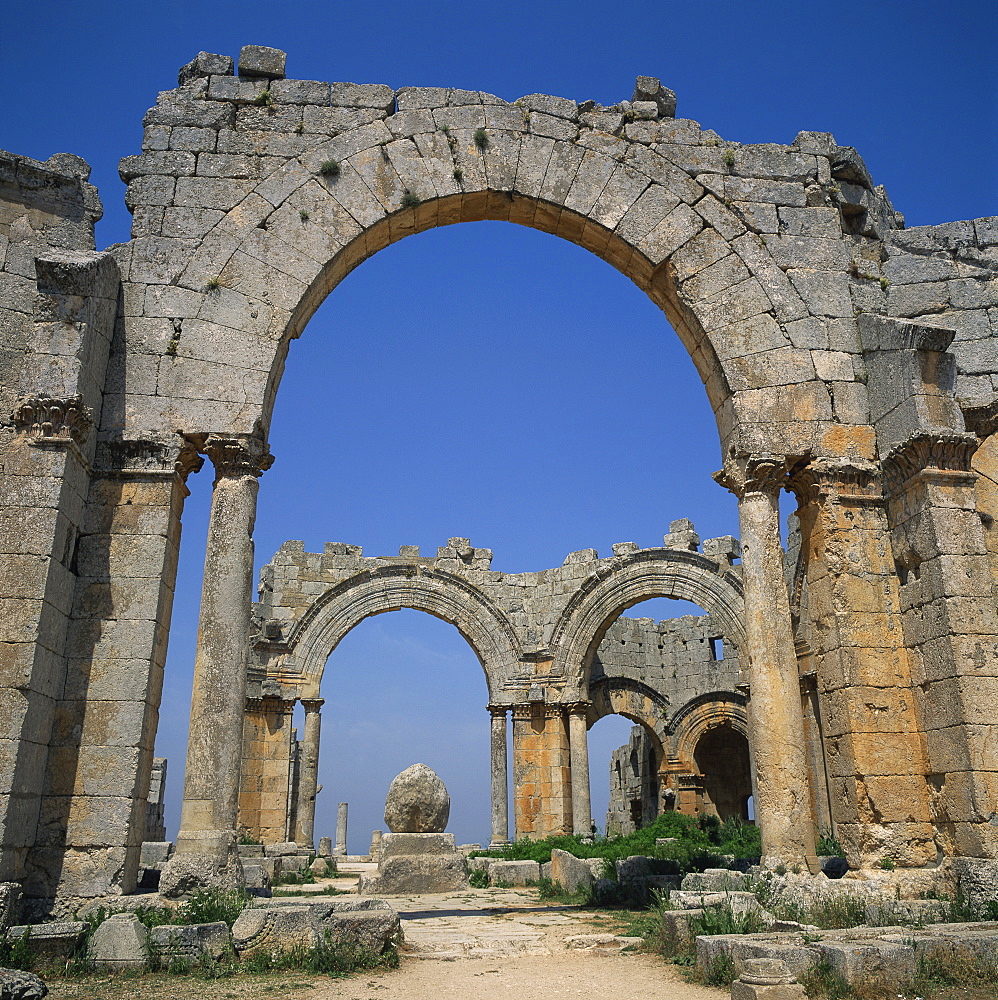 Remaining arches of the Cruciform Church, dating from between 476 and 491 AD, with the base of the pillar of St. Simeon the Stylite, Dead City region, northern Syria, Middle East