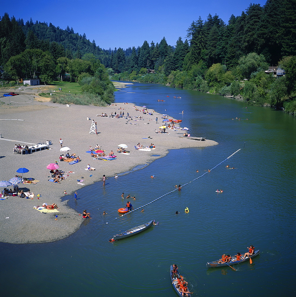 Aerial view over people boating and paddling in the Russian River at Monte Rio, a popular recreational and camping area, Sonoma County, California, United States of America, North America