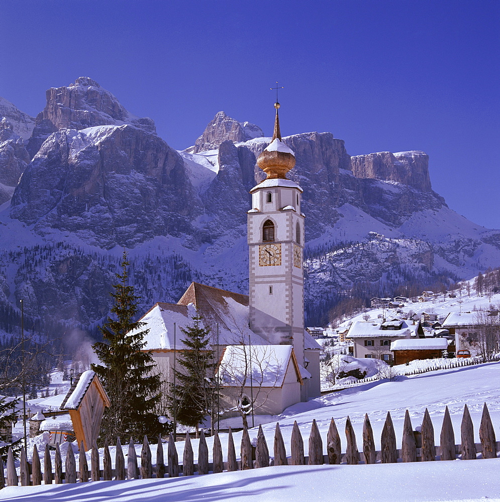 Christian church in snowy landscape, Colfosco in Badia and Sella Mountains in winter, Dolomites, Trentino-Alto Adige, South Tirol (Tyrol), Italy, Europe