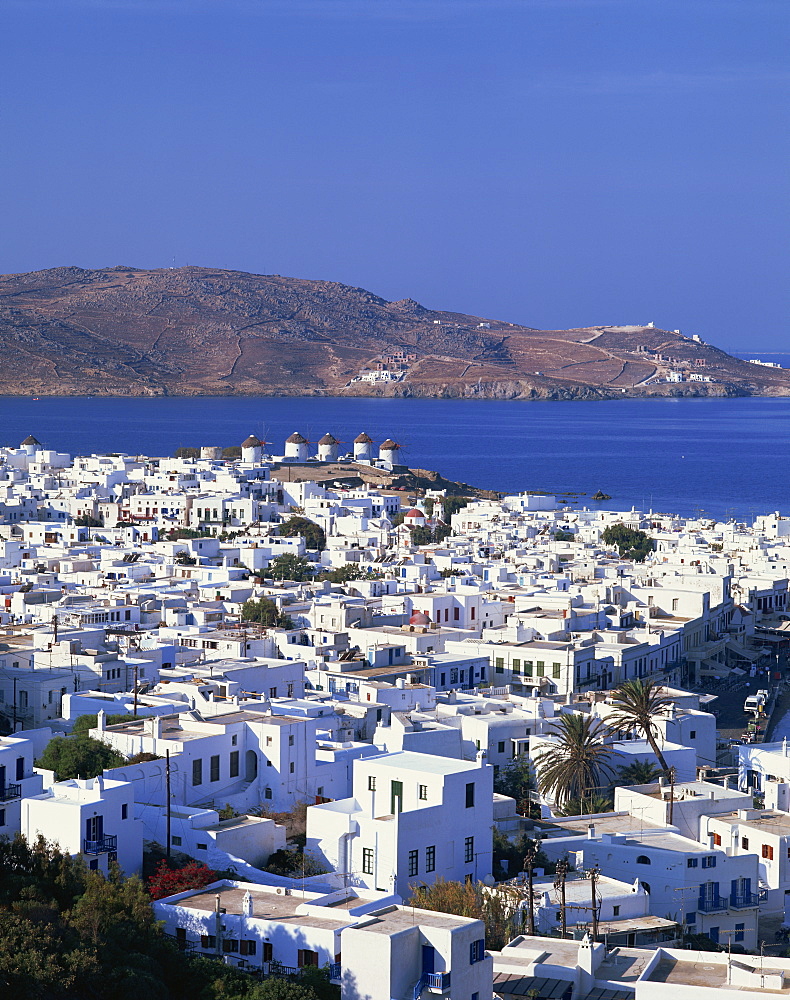 White houses and windmills, with the sea and hills in the background, on Mykonos, Cyclades Islands, Greek Islands, Greece, Europe