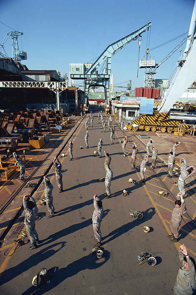 Workers stretching and exercising before work in the morning, Yokohama, Japan, Asia