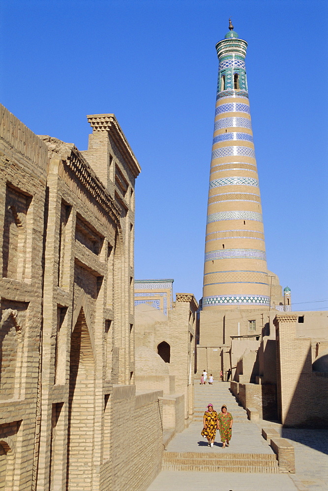 Islam Khodja minaret, Prince Makhmud mausoleum on left, Khiva, Uzbekistan, Central Asia