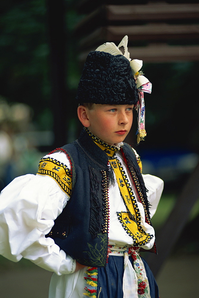 Portrait of a boy in traditional dress waiting to sing at the Straznice Folk Festival in South Moravia, Czech Republic, Europe