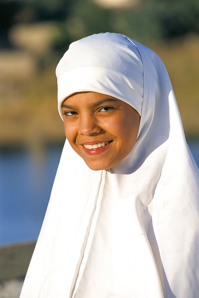 Portrait of a girl in traditional headscarf, Qasr, Dakhla oasis, Western Desert, Egypt, North Africa, Africa