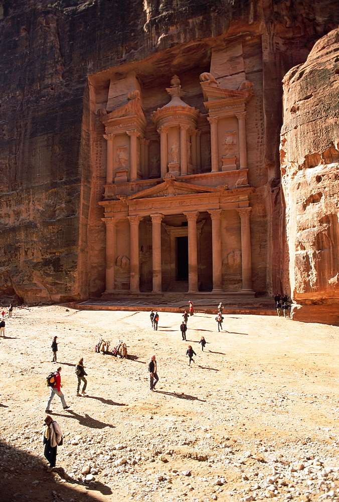 Tourists silhouetted in front of the Treasury (El Khazneh) (Al Khazna), Nabatean archaeological site of Petra, UNESCO World Heritage Site, Jordan, Middle East