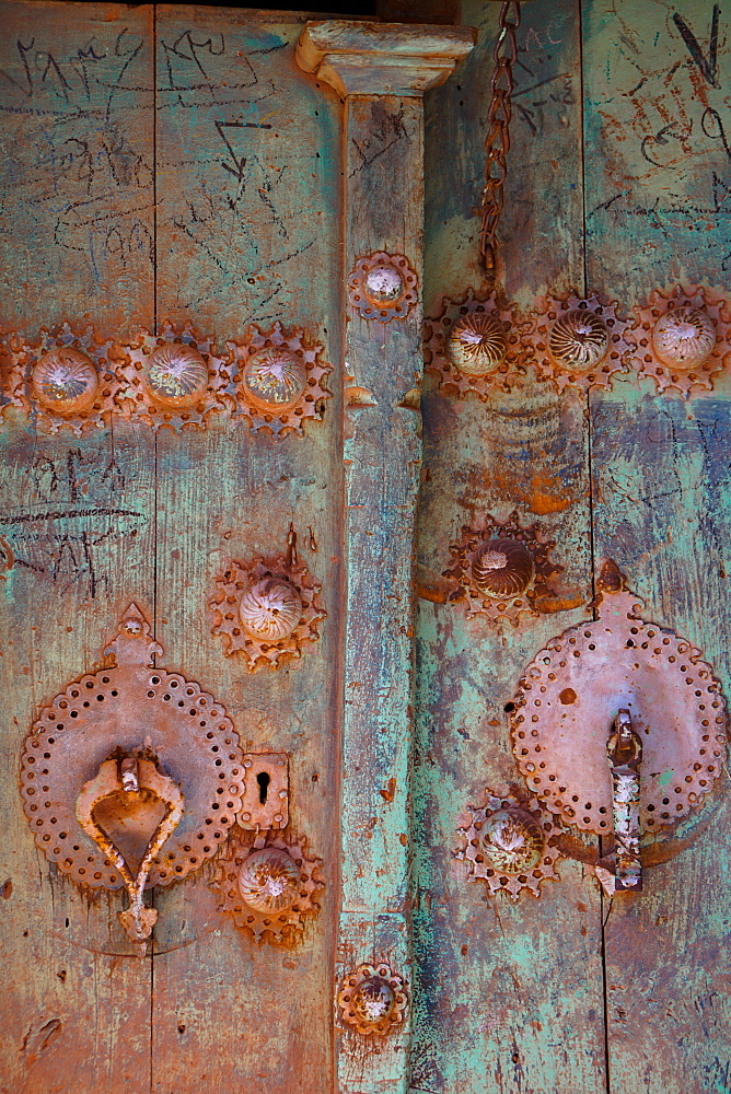 Male (right) and female door knockers giving different sounds to ensure the right gender person receives the guest, Abyaneh, Iran, Middle East