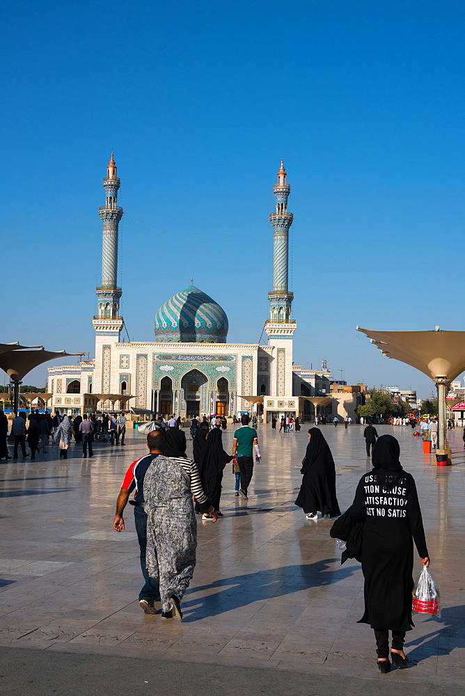 Astane Square in front of the Imam Hassan Mosque, unusually challenging message (Can't Get No Satisfaction) on girl's back, Iran, Middle East