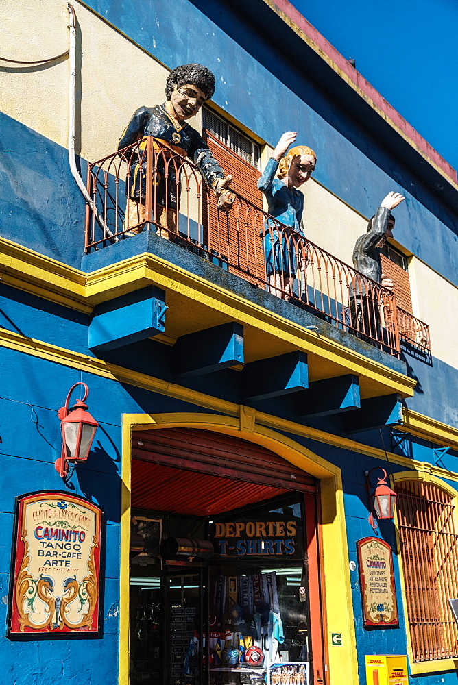 Balcony over bar on El Caminito with statues of Maradona, Evita and Gardel, a tango singer, La Boca, Buenos Aires, Argentina, South America