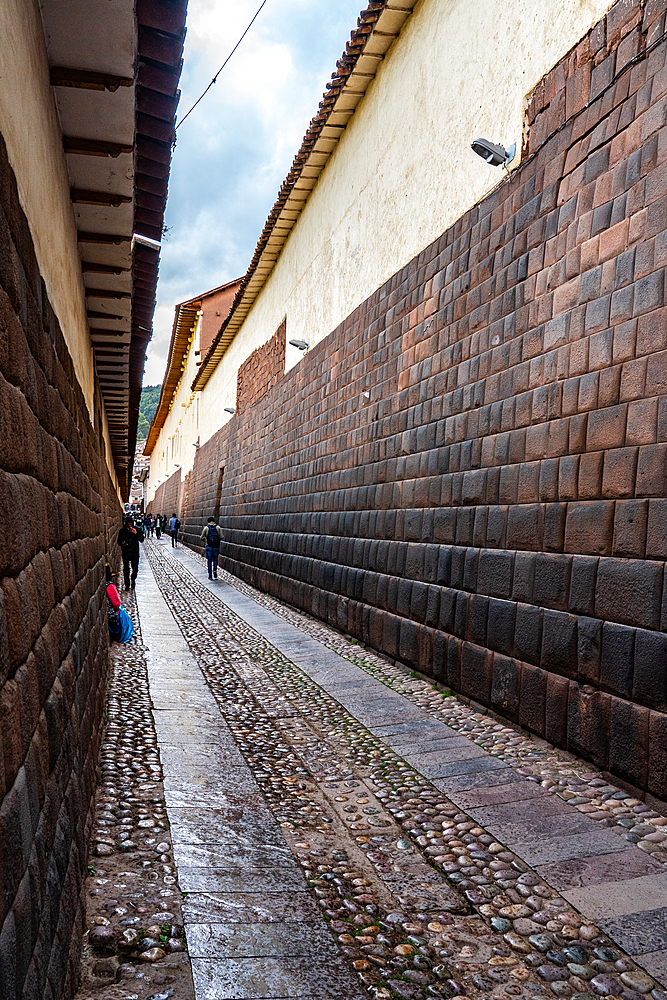 Long view of the precision-built, mortar-less Incan masonry of Loreto Street, Cusco, UNESCO World Heritage Site, Peru, South America