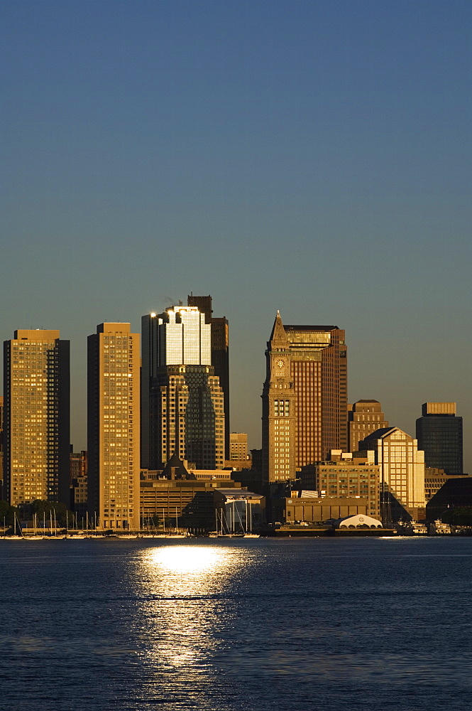 City skyline across Boston Harbor at dawn, Boston, Massachusetts, USA