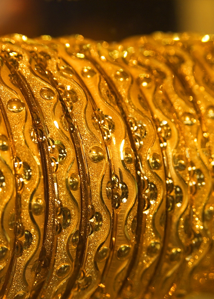 Close up of gold bangles on display, the Gold Souk, Deira, Dubai, United Arab Emirates, Middle East