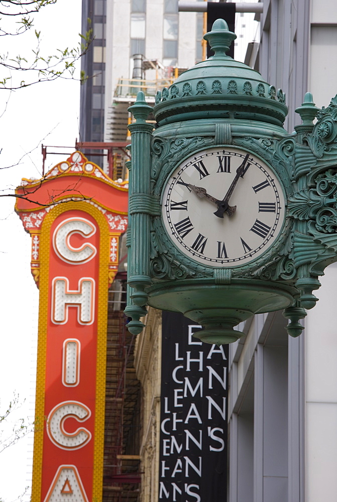 The Marshall Field Building Clock and Chicago Theatre behind, Chicago, Illinois, United States of America, North America