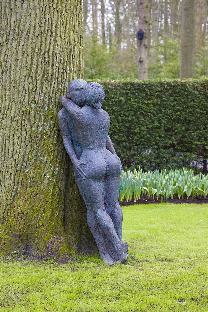 Modern sculpture of nude couple embracing, Keukenhof, park and gardens near Amsterdam, Netherlands, Europe