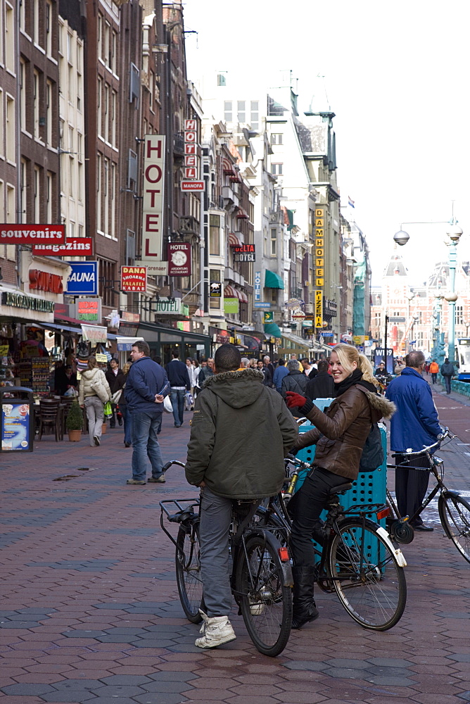 Damrak, a busy thoroughfare in the centre of the city, Amsterdam, Netherlands, Europe