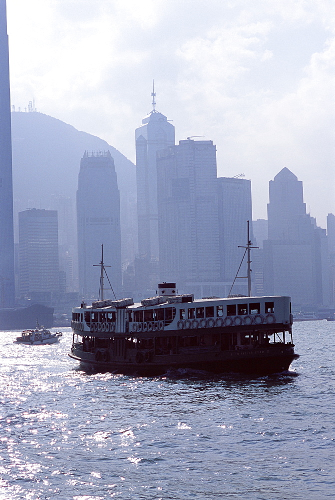 Star Ferry, Victoria Harbour, with Hong Kong Island skyline in mist beyond, Hong Kong, China, Asia