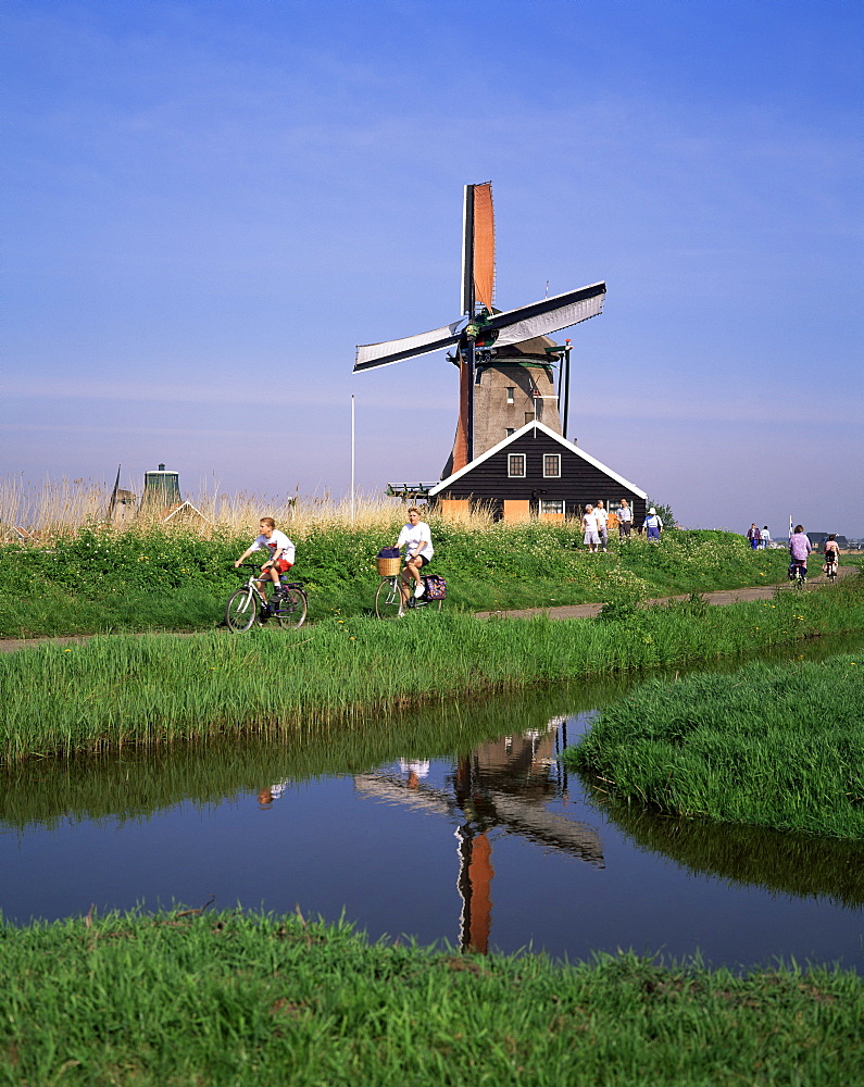 People riding bicycles, Zaanse Schans, near Amsterdam, Holland, Europe