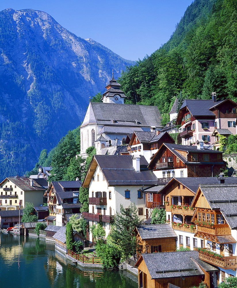 Houses, chalets and the church of the village of Hallstatt in the Salzkammergut, Austria 