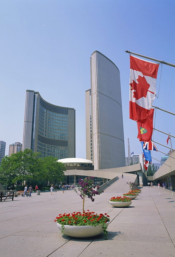 Flags outside the modern buildings of City Hall in Toronto, Ontario, Canada, North America