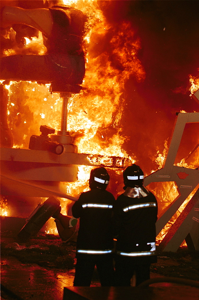 Valencia - Spain - Las Fallas Fiesta - Firemen on duty at the burning of the Fallas