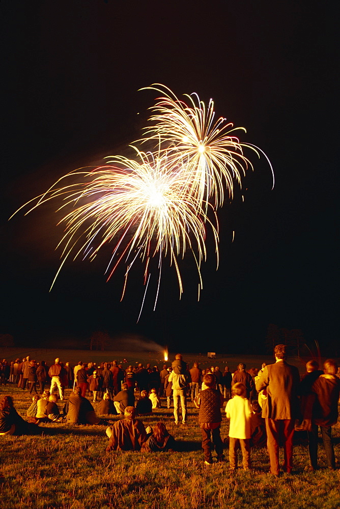 Crowd watching fireworks display, United Kingdom, Europe