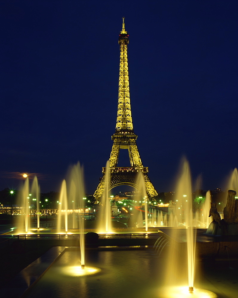 The Eiffel Tower with water fountains, illuminated at night, Paris, France, Europe