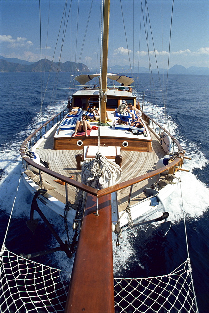 Tourists sunbathing on deck of gulet, Turkey, Asia Minor, Eurasia