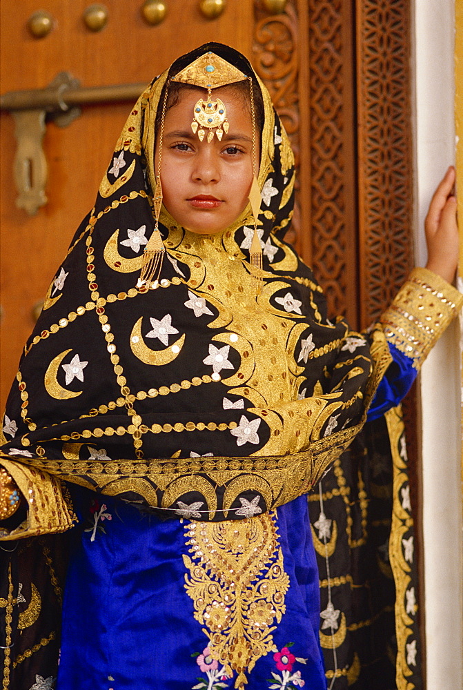 Young girl in traditional dress, Bahrain, Middle East