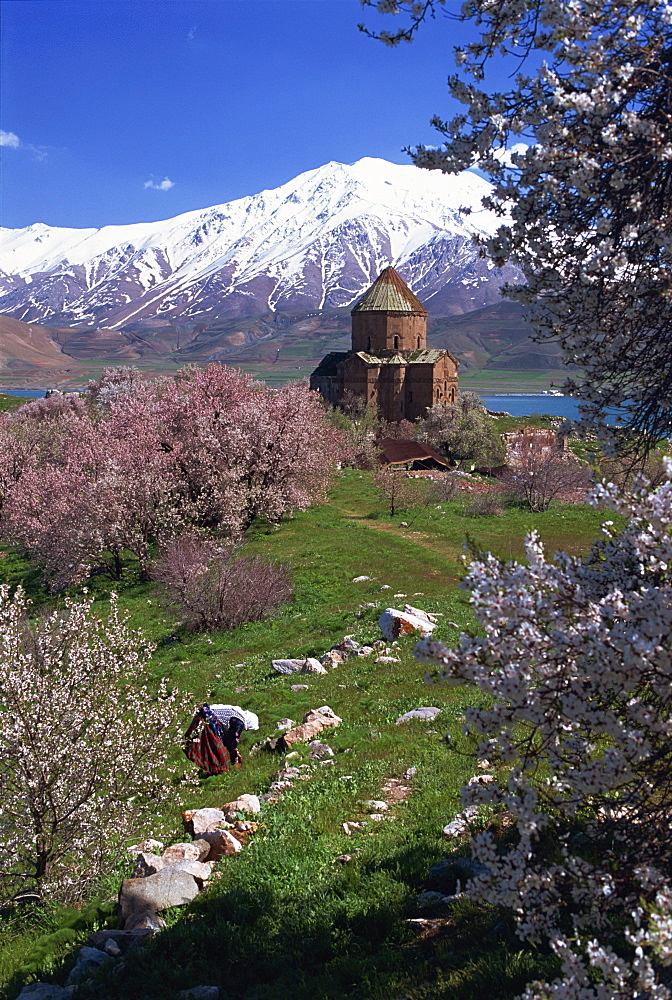 Figure at work below the Armenian Church of the Holy Cross, on Akdamar Island, beside Lake Van, Anatolia, Turkey, Asia Minor, Eurasia