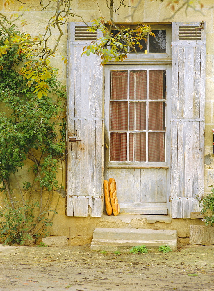 Rustic door and bread, Aquitaine, France, Europe