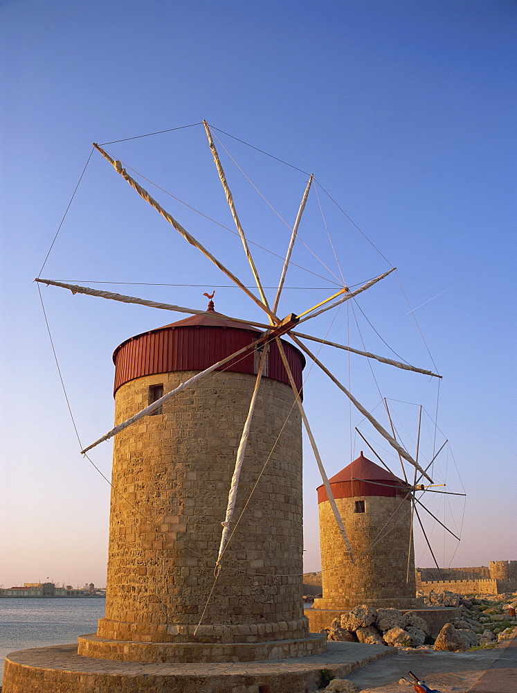 Traditional old stone windmills in dusk light, Rhodes Town, Rhodes, Dodecanese Islands, Greek Islands, Greece, Europe