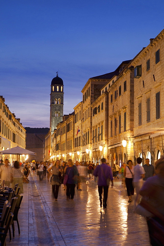 Placa, Stadun, lit up at dusk with cafes and people walking, Dubrovnik, Croatia, Europe