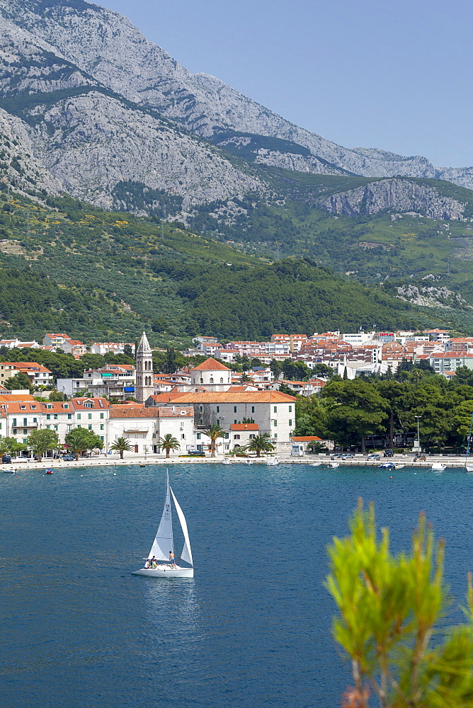 Makarska harbour with yacht and mountains behind, Dalmatian Coast, Croatia, Europe