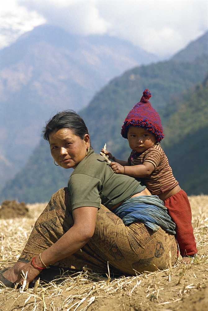 Portrait of a mother and son in a field in Nepal, Asia