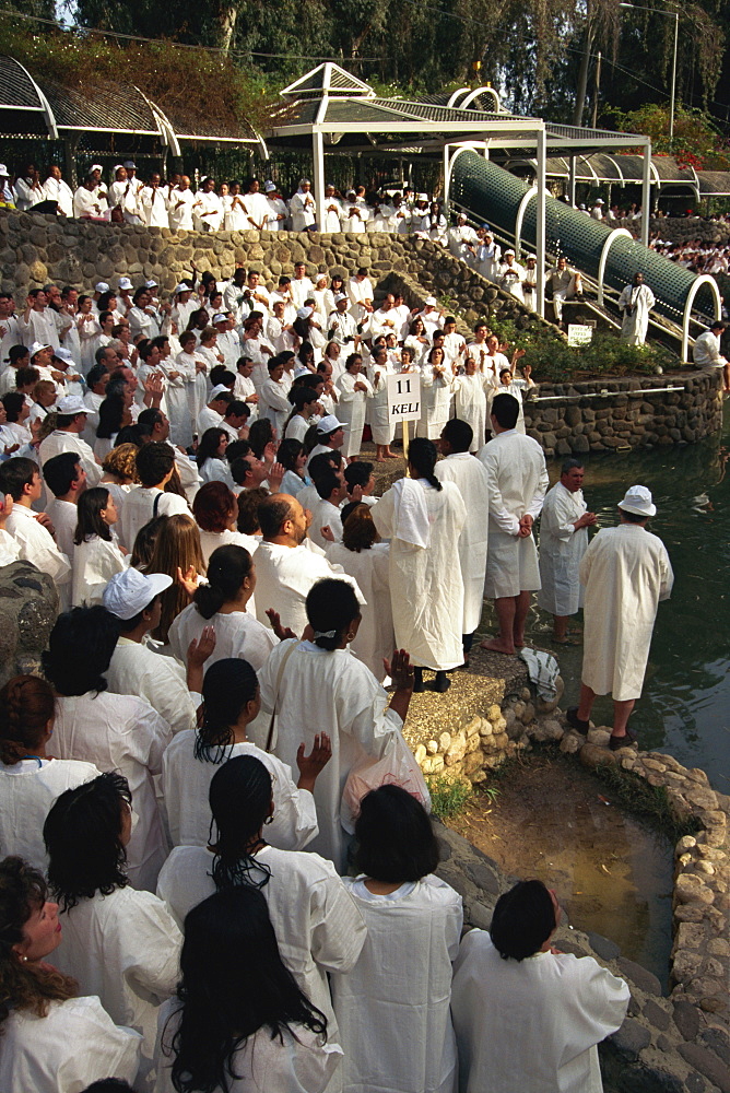 Ceremony of mass baptism into Christianity in the Sea of Galilee at Yardent, Israel, Middle East