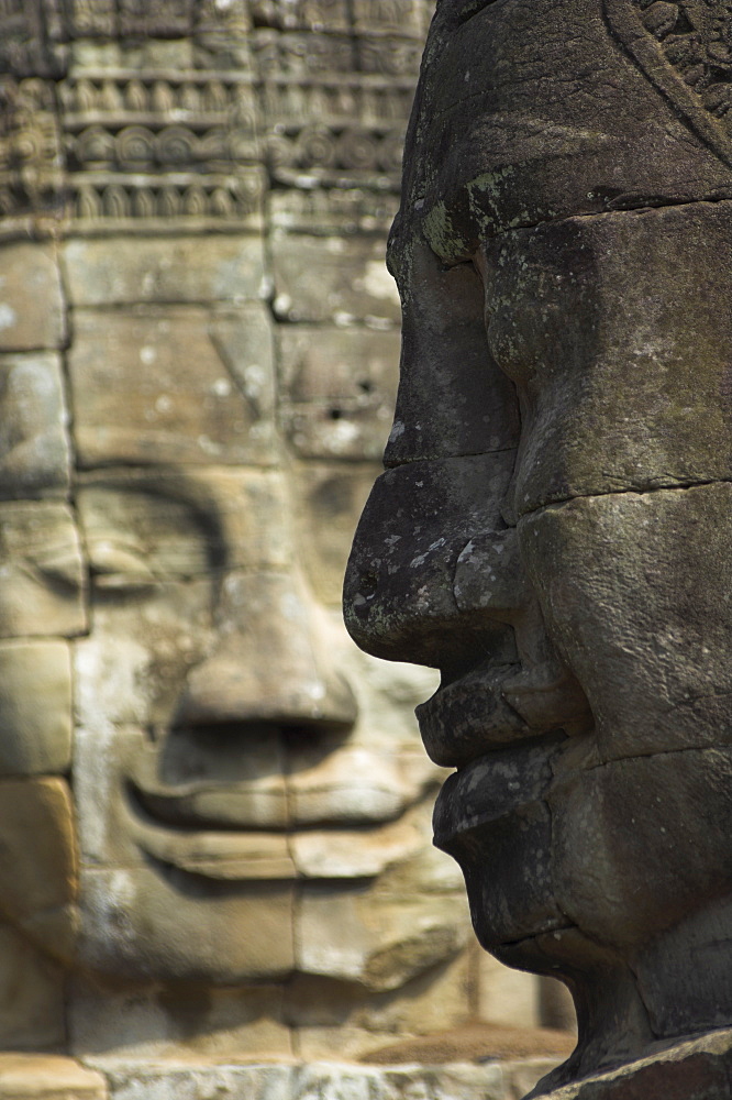 Stone statuary of human faces, Ta Prohm temple, Angkor, UNESCO World Heritage Site, Siem Reap, Cambodia, Southeast Asia, Asia