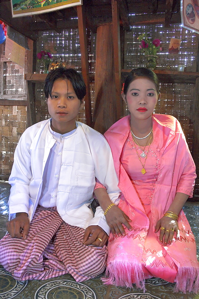 Portrait of bride and groom in their ceremonial dress during their wedding, Lebin, Shan State, Myanmar (Burma), Asia