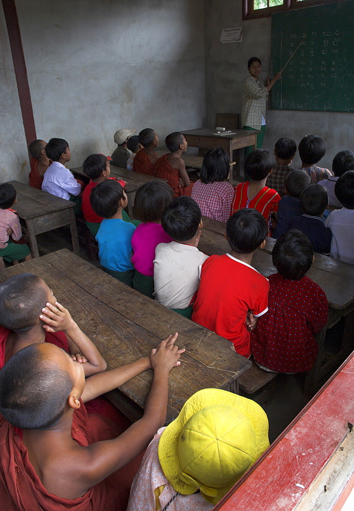 School children in classroom listening to teacher in new school building built by local NGO, village of Thit La, Shan State, Myanmar (Burma), Asia