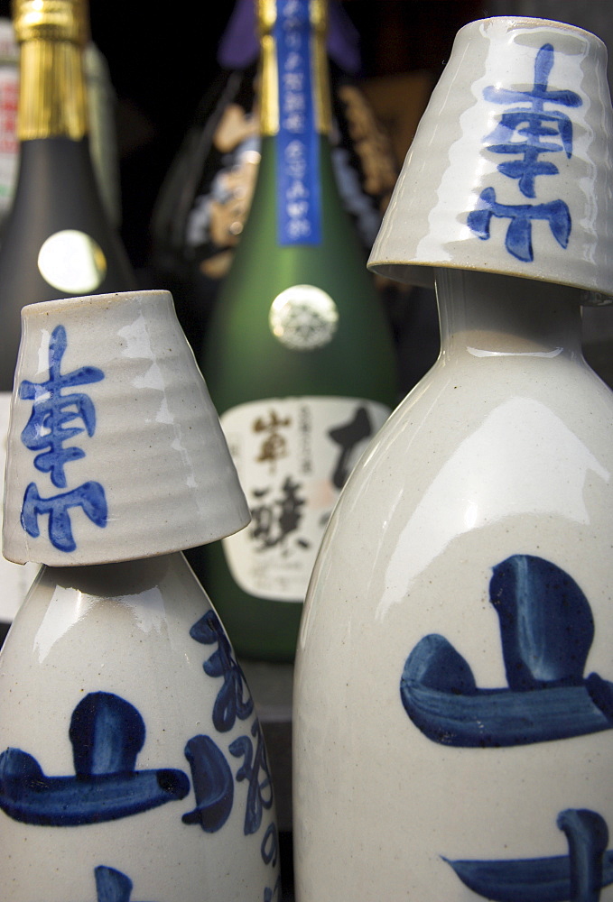 Traditional sake bottle with assorted glasses, sake brewery, historical centre, Sanmachi, Takayama, Hida district, Honshu, Japan, Asia