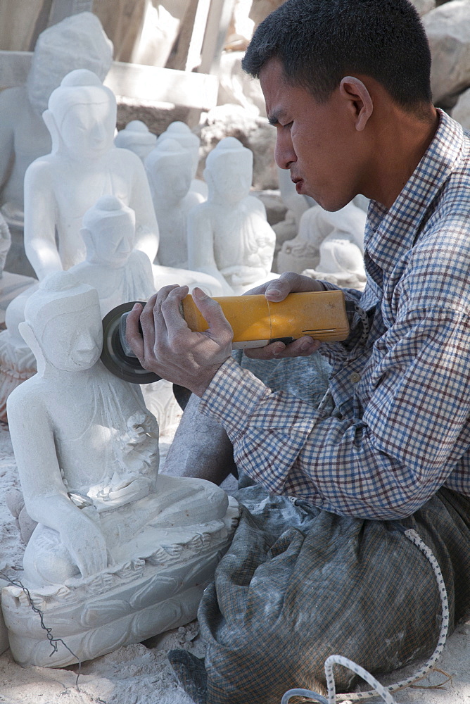 Man carving Buddha in white stone, Mahamuni pagoda, Mandalay, Myanmar, Asia