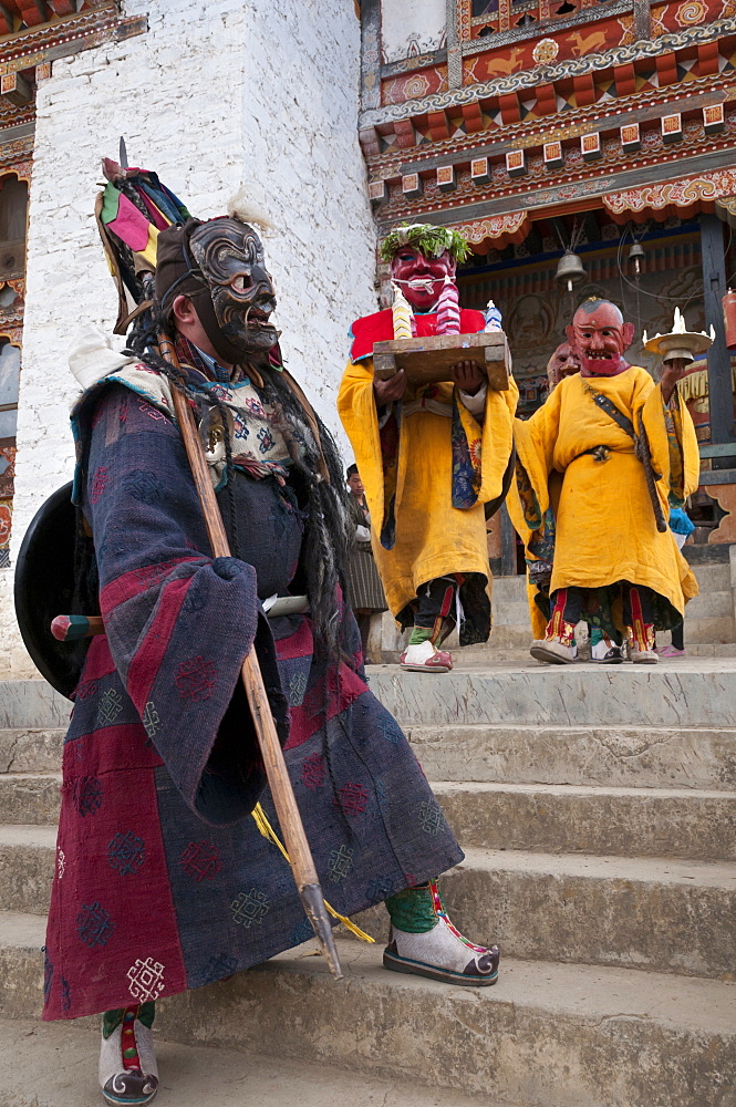 Masked dancers at Buddhist monastery, Ura, Bhutan, Asia