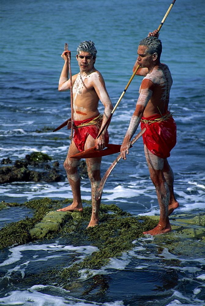 Two Aborigines with body decoration hunting seafood at Jervis Bay, New South Wales, Australia, Pacific