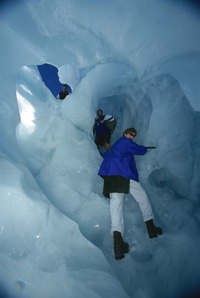 Climbing through tunnels of ice, Fox Glacier, South Island, New Zealand, Pacific