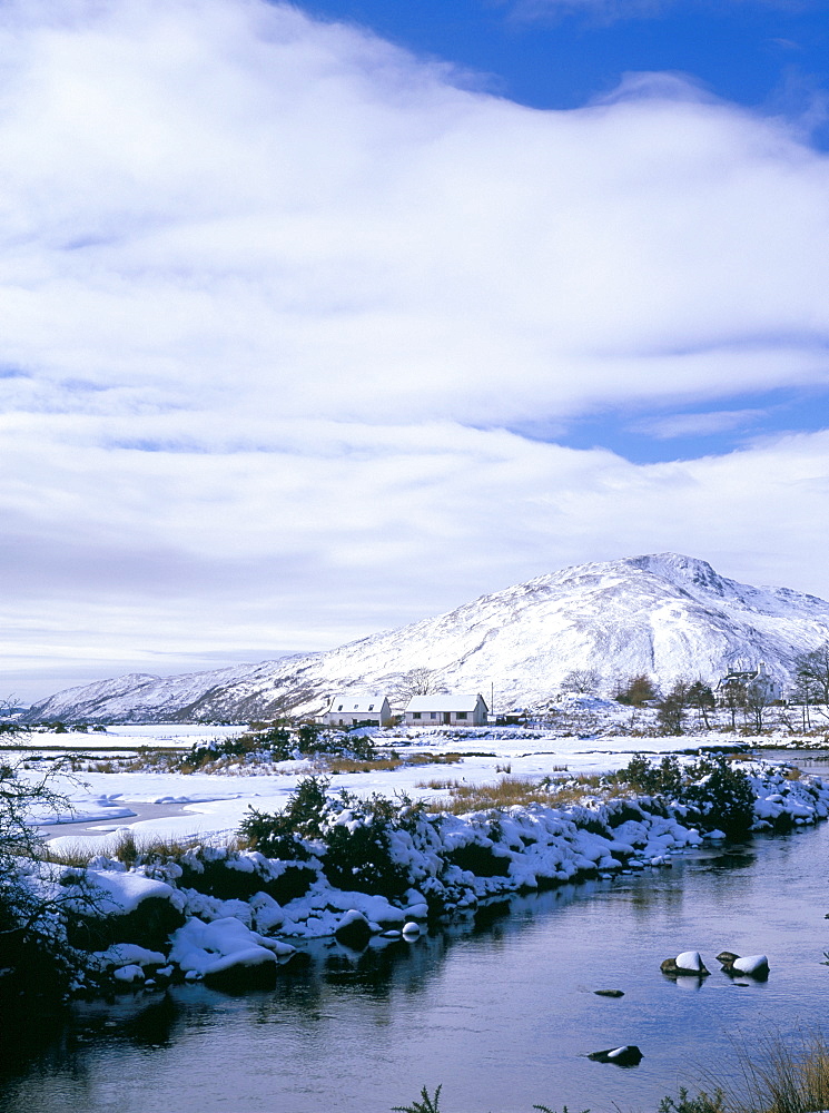 The Glenmore River in Galltair, with snow on the ground and mountains of Skye in later winter, Glenelg, Highland region, Scotland, United Kingdom, Europe