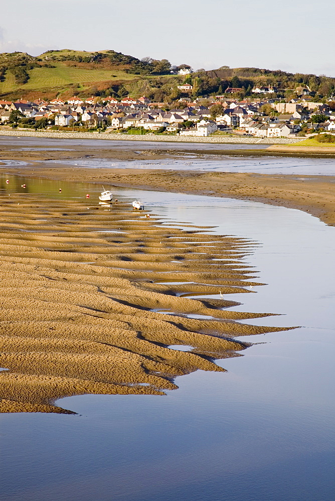 Exposed rippled sandbank on Conwy River estuary at low tide, with Deganwy beyond, Conwy, Wales, United Kingdom, Europe