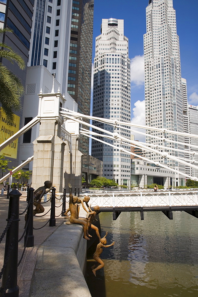 The First Generation bronze sculpture by Chong Fah Cheong of boys jumping into river, Boat Quay Conservation Area, by Cavenagh Bridge with skyscrapers of Central Business District beyond, Singapore, Southeast Asia, Asia