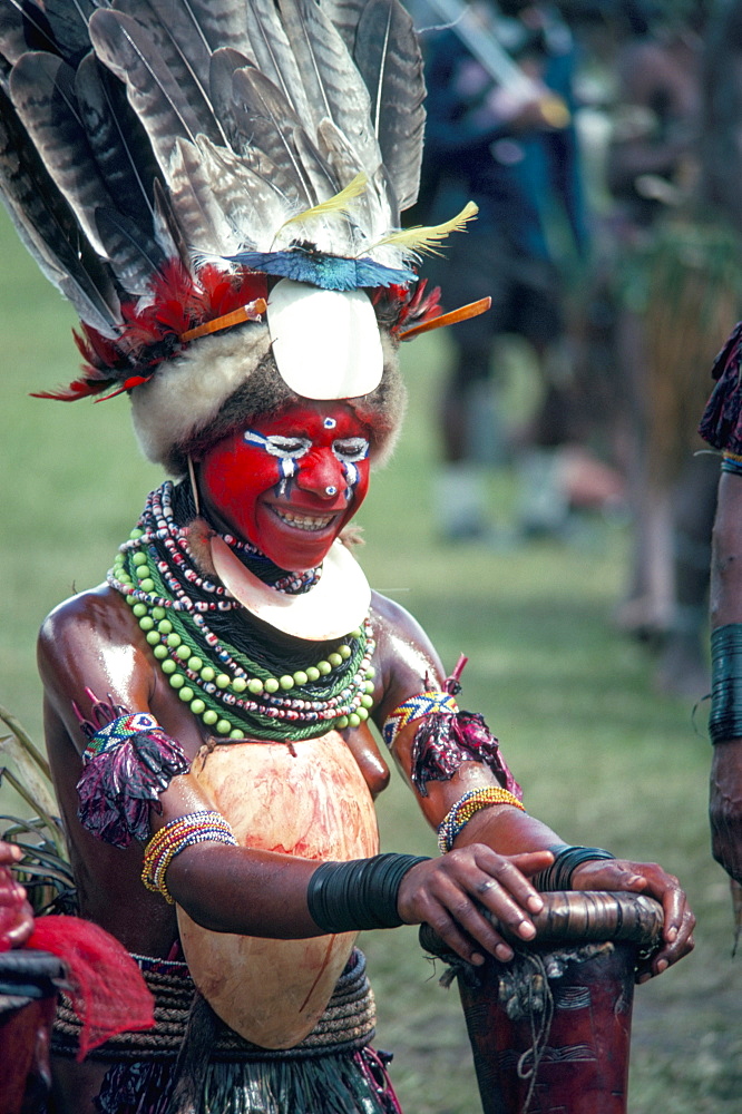 Traditional facial decoration and head dress of feathers, Papua New Guinea, Pacific