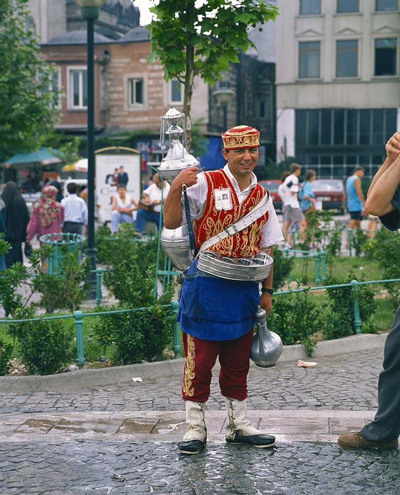 Portrait of a drinks seller, a man in traditional clothing, outdoors in the street, Istanbul, Turkey, Europe