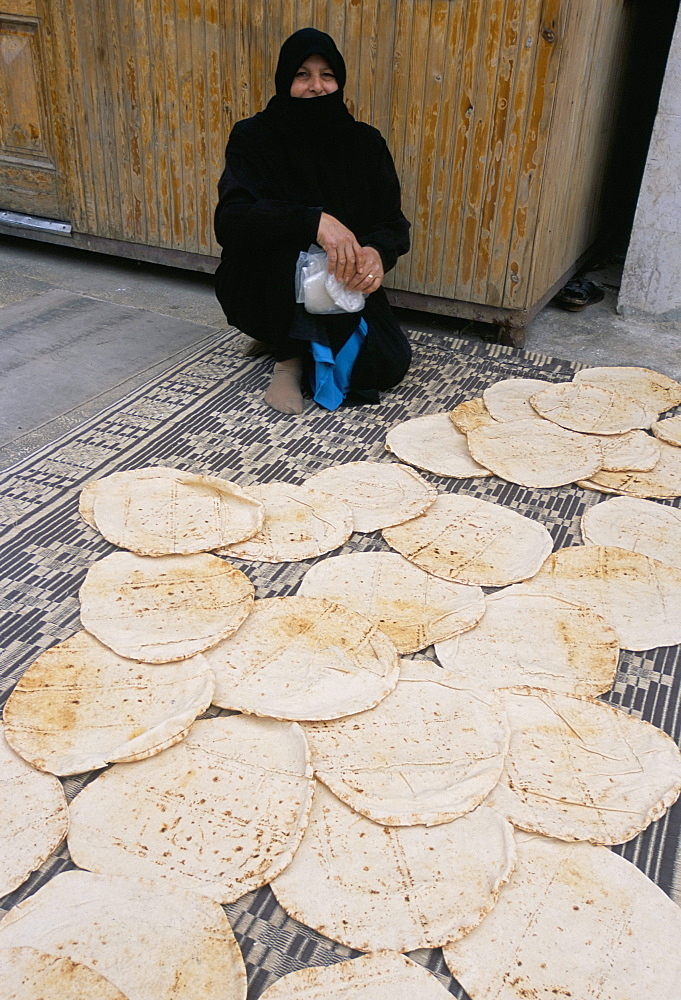 Woman selling bread in the Armenian area, Aleppo, Syria, Middle East