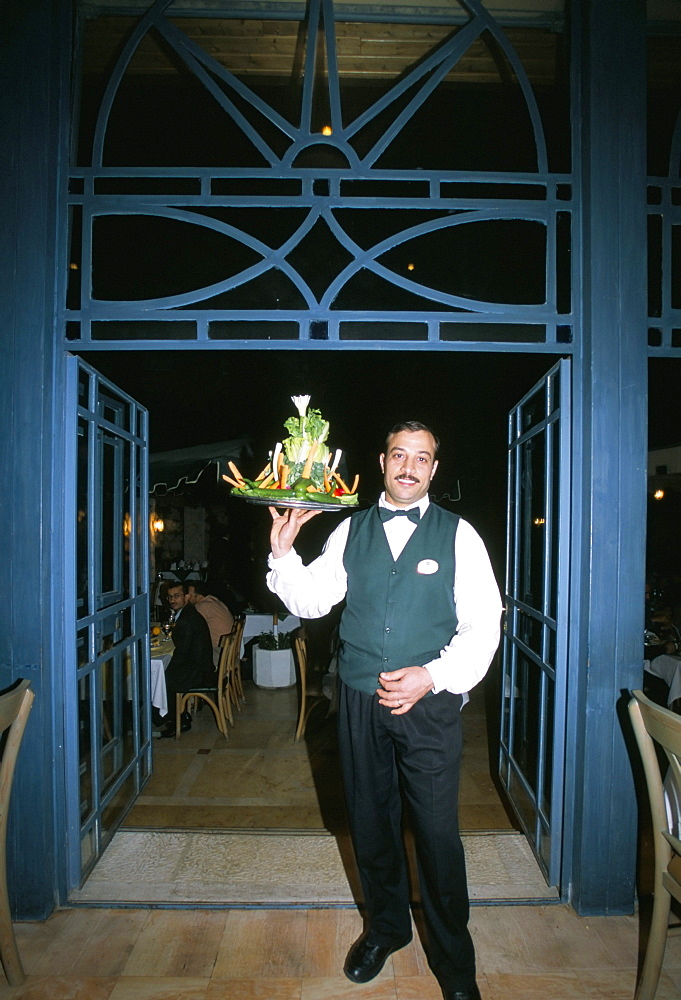 Waiter with signature salad at Fakhr El-Din restaurant, Amman, Jordan, Middle East