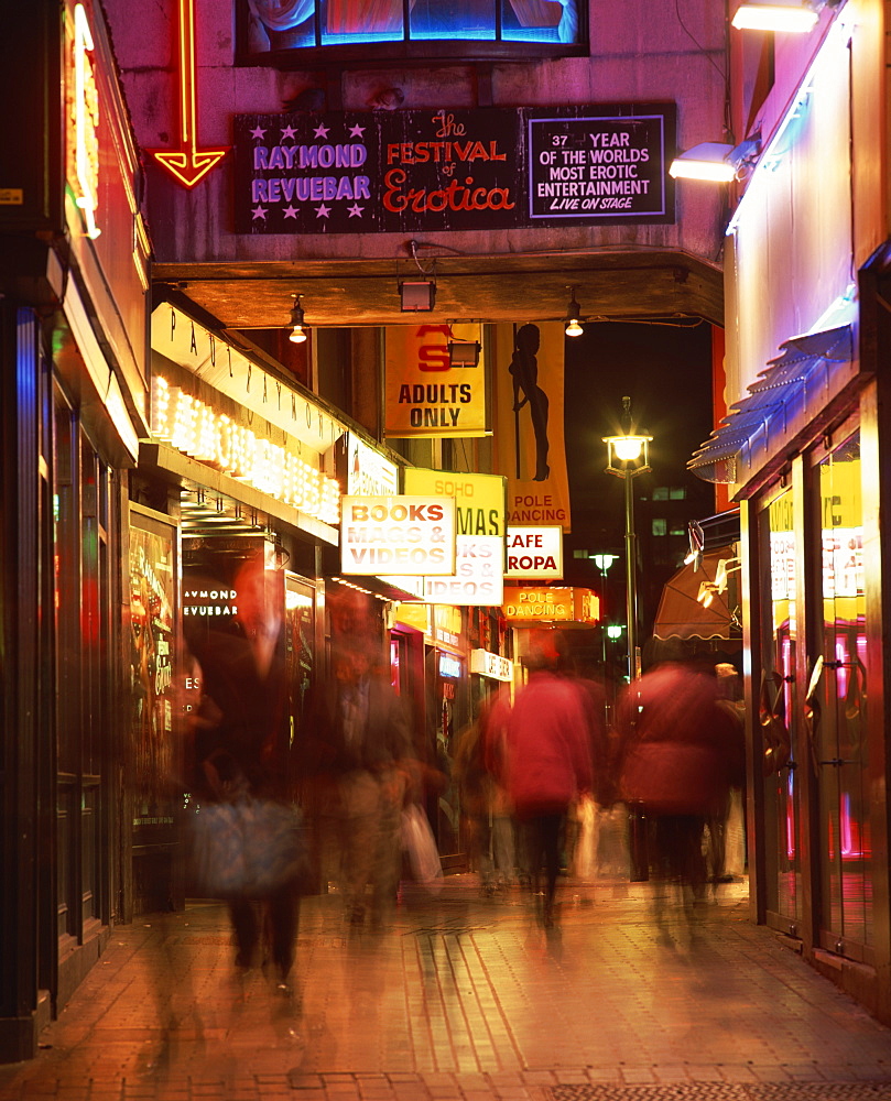 Exterior of sex shops and signs in red light area at night, Soho, London, England, United Kingdom, Europe